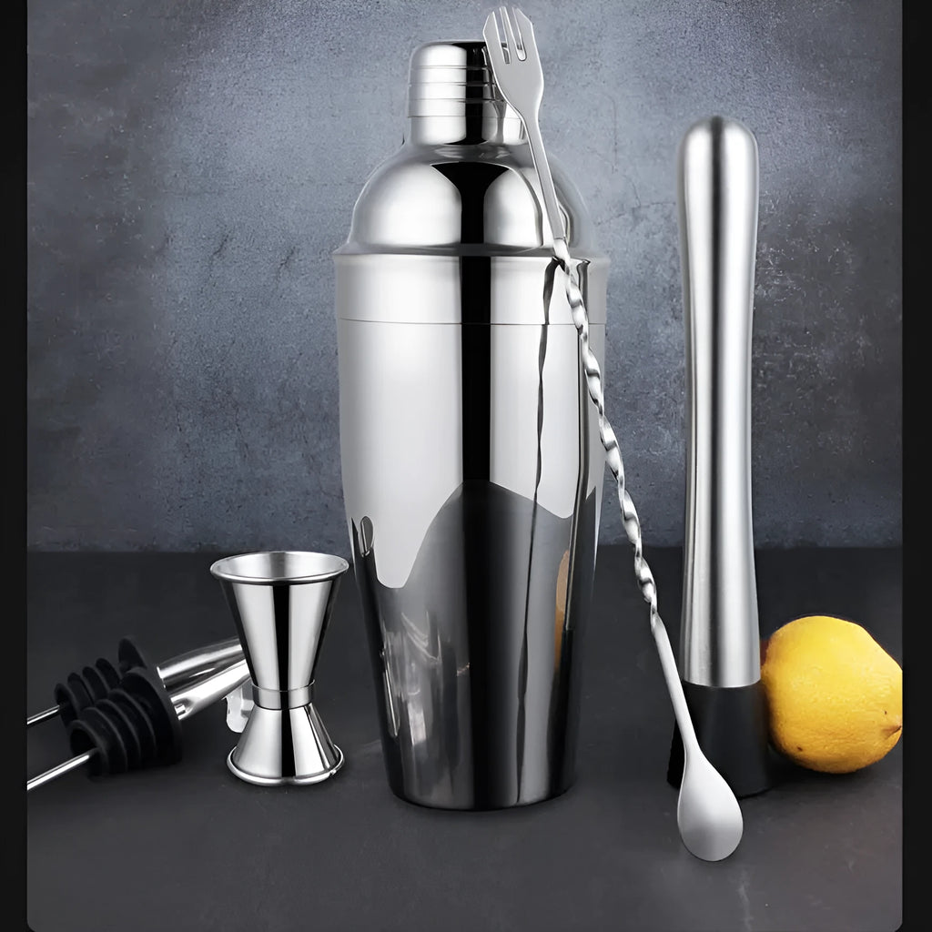 23-piece stainless steel cocktail set with drink mixers on a bar