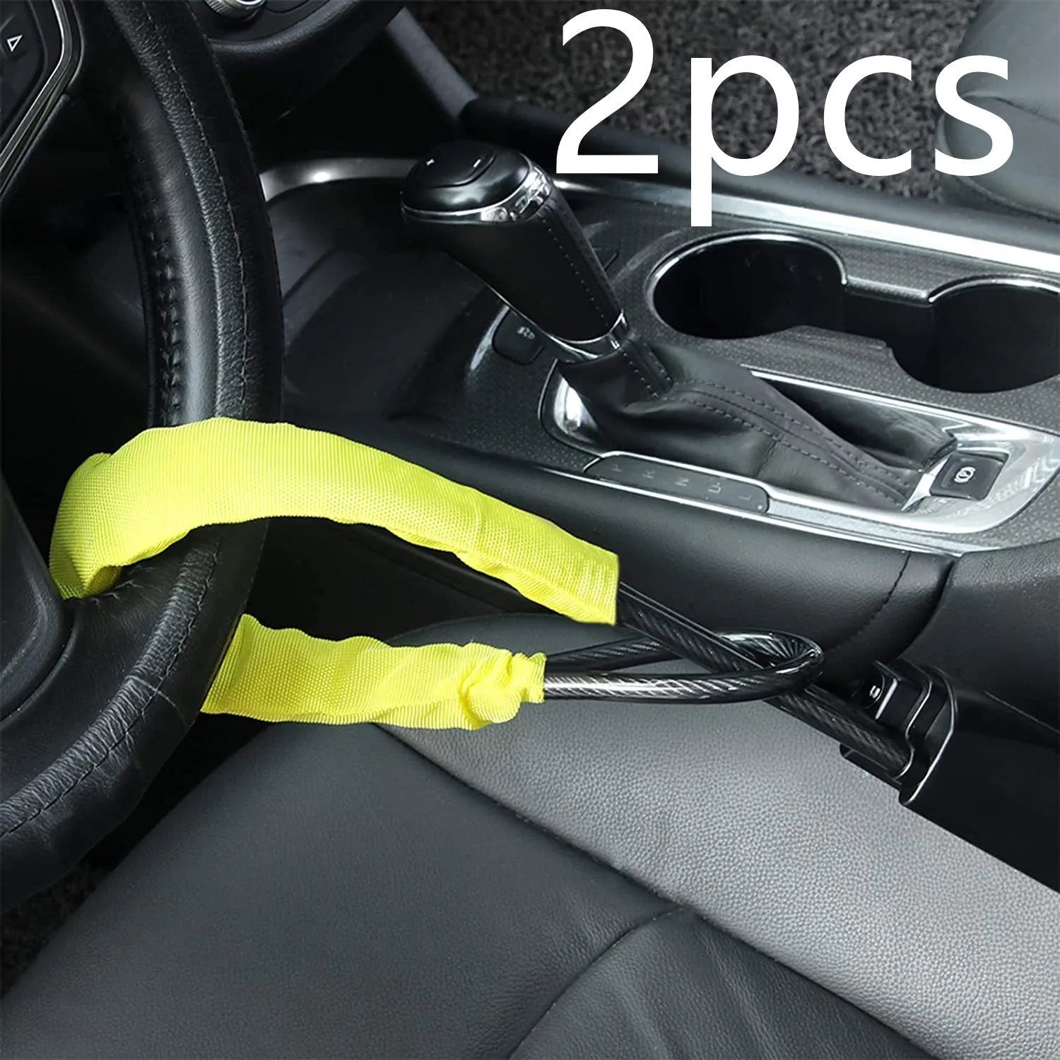 Red iron wire rope steering wheel lock for General Motors cars on a steering wheel.