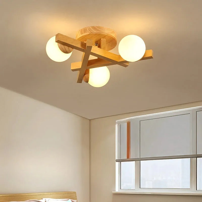Modern three-headed pendant ceiling light with neutral bulbs in a Nordic style, suitable for a wooden living room.
