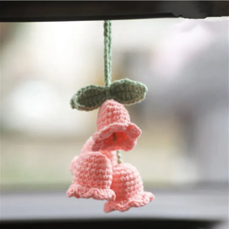 Green and white knitted wool car plant decoration with basin base and hanging rope