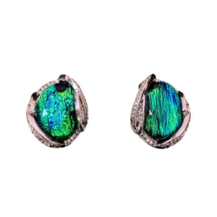 Silver resin stud earrings with rhinestone encrusting and irregular retro shape in silver needle green
