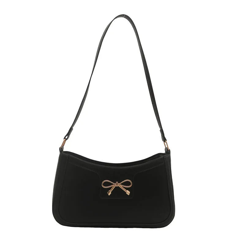 Western-style shoulder bag with bow decoration in multiple colours showing 24x14x5cm dimensions