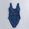 Navy blue women's slim-fitting one-piece triangle swimsuit on a mannequin.