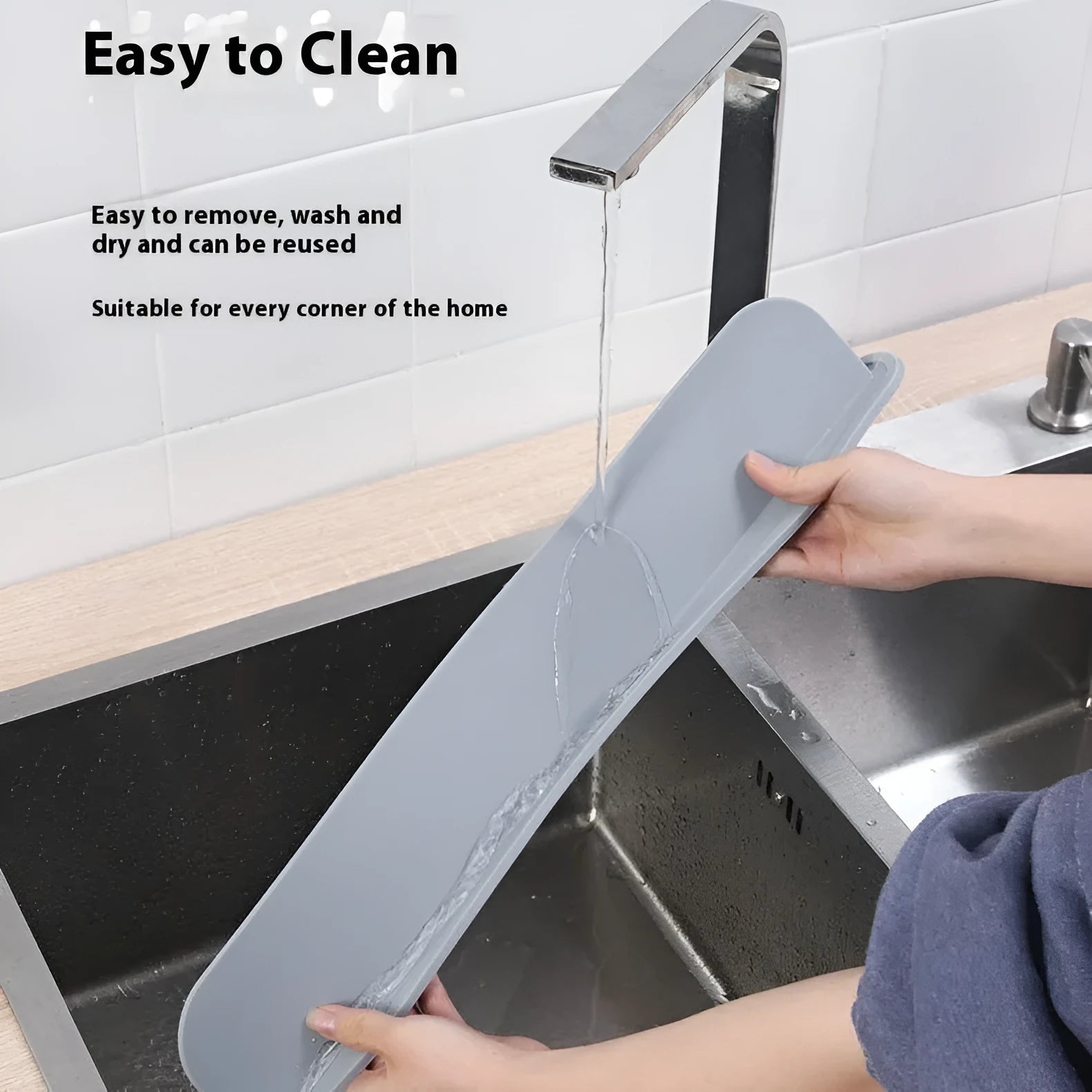 Grey silicone kitchen sink splash guard plate measuring 52mm by 85mm