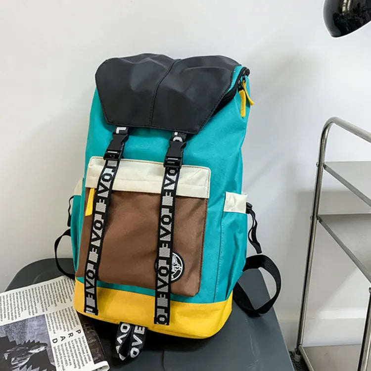 Oxford cloth backpack in black, green, or red with multiple carry handles and straps.