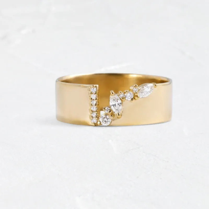 Gold electroplated copper ring for women with shining zircon details, shown on a finger.