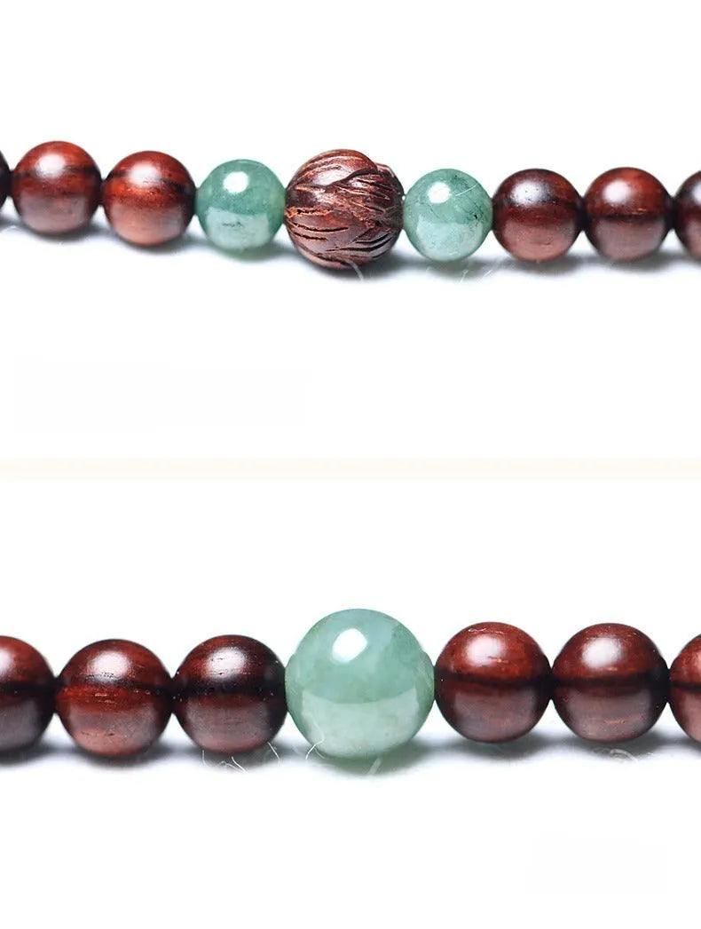 Rosewood bead bracelet with a carved Pterocarpus Santalinus and Hotian Jade stone pendant.