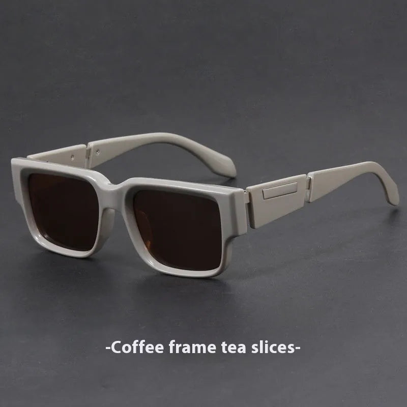 Gray blue square thick frame retro sunglasses with UV-proof lenses on a flat surface.