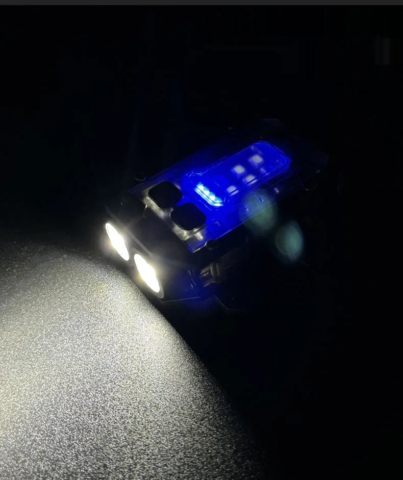 Mini tactical flashlight with USB charging cable showing dual lighting modes and backpack mount attachment point