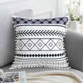 Bohemian national style polyester cushion cover in light grey on a sofa.