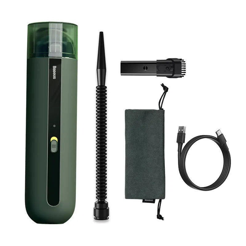 Starry sky black handheld cordless car vacuum cleaner with blowing hose accessory on a desktop.