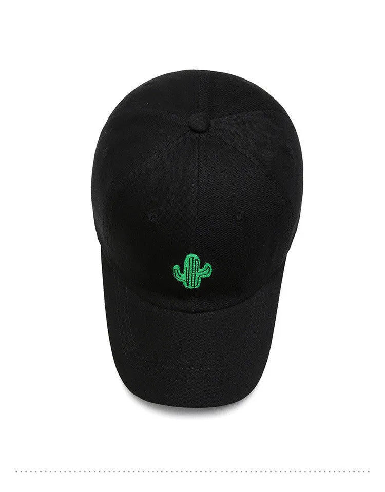 Cotton baseball cap with embroidered cartoon pattern in black, side view, unisex adjustable design