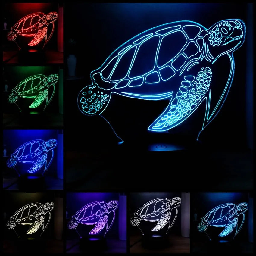 3D acrylic turtle-shaped LED night light with multi-colour illumination on a wooden surface.