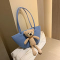 Large woven shoulder bag in cotton and linen fabric with double straps and three-dimensional pockets