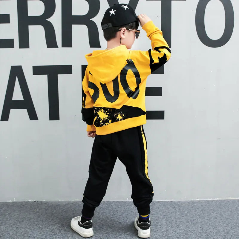 Boys' black and yellow hooded cotton tracksuit sets shown in Korean style