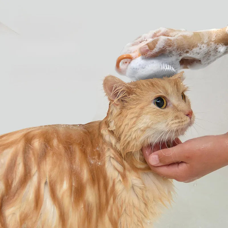 Orange silicone dog bath brush with shampoo dispenser and soft TPR bristles for pet grooming
