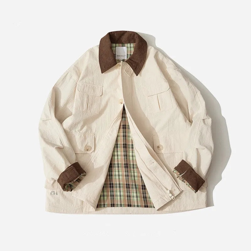 Green casual jacket with long sleeves and side seam pockets on a hanger
