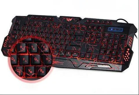 Black 3-colour LED backlit gaming keyboard with ergonomic S-shaped design and adjustable stand on desk
