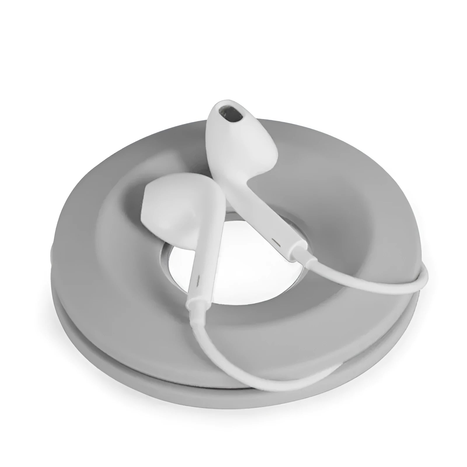 Silicone donut cord reel with suction cup and magnet for organising mobile phone and headphone cables