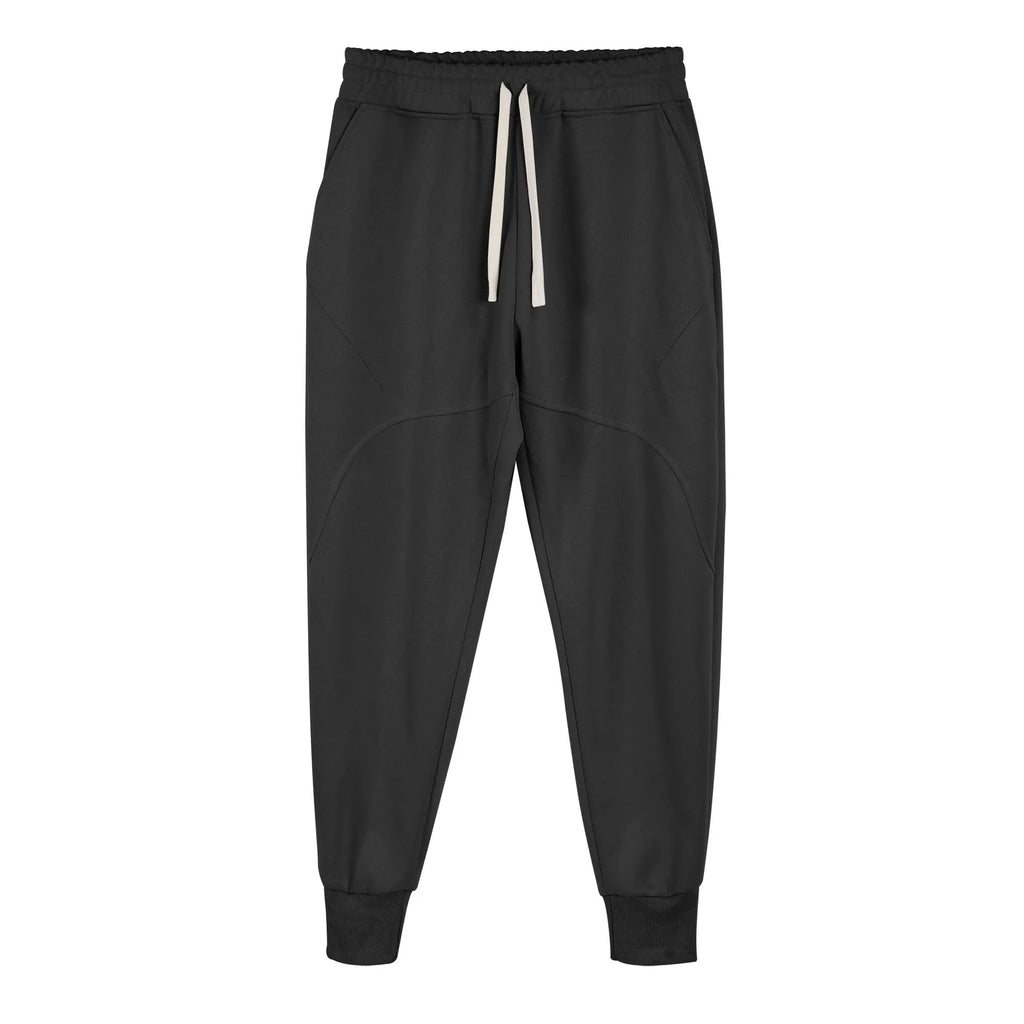 Man wearing grey ankle-tie drawstring sweatpants for casual leisure.
