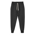 Man wearing grey ankle-tie drawstring sweatpants for casual leisure.
