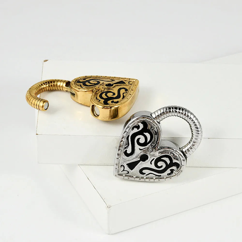 Heart-shaped stainless steel ear piercings in gold and steel colour options showing front and back views
