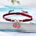 Women's Natural Strawberry Quartz bracelet with a fruit-shaped crystal bead on an elastic cord.