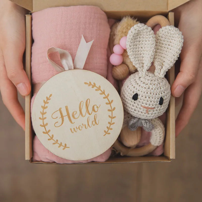 Newborn baby shower toy set with six bath toys in blue, peach, and brown options on a plain background