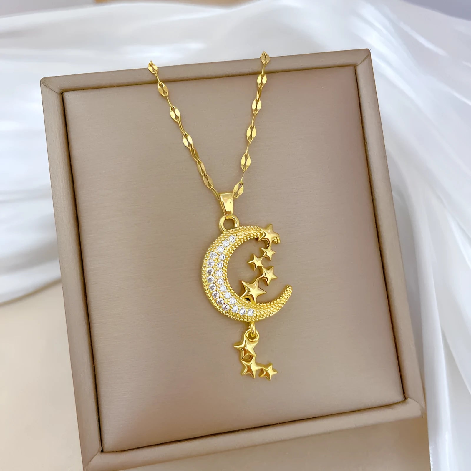 Moon Tassel Necklace with diamond-set copper pendant on a stainless steel chain.