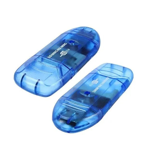 Transparent plastic USB card reader with LED light on a desk.