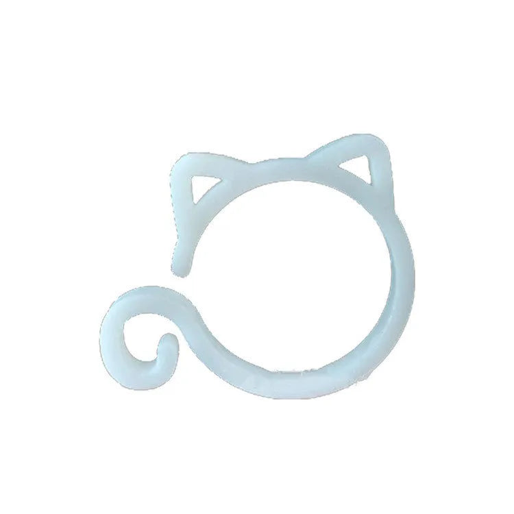 A colourful cat-shaped plastic clip for securing plant stems in the garden.