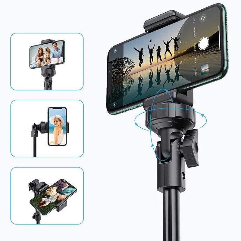 Black aluminium selfie stick tripod extended next to an iPhone, showing its five-section telescopic design.