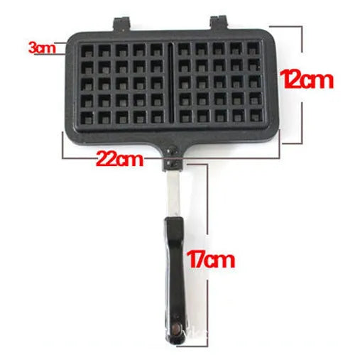 Black aluminium alloy waffle cake mold with nonstick plates and locking handle on gas stove