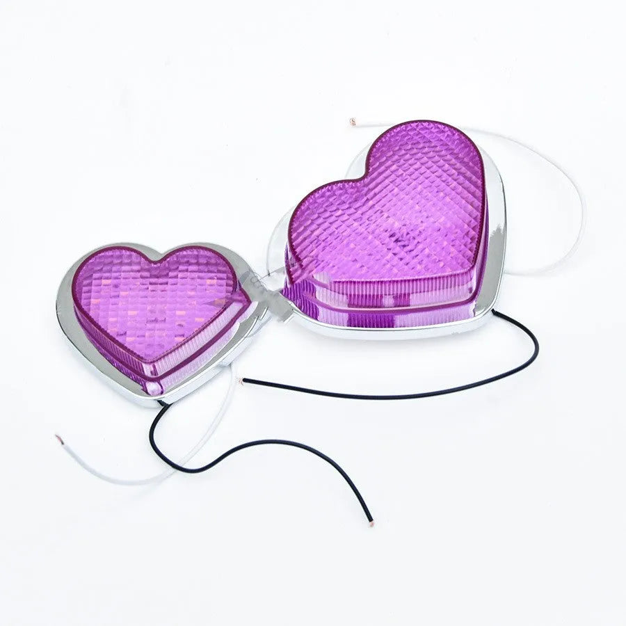 Heart-shaped red LED automotive sidelight mounted on car fender