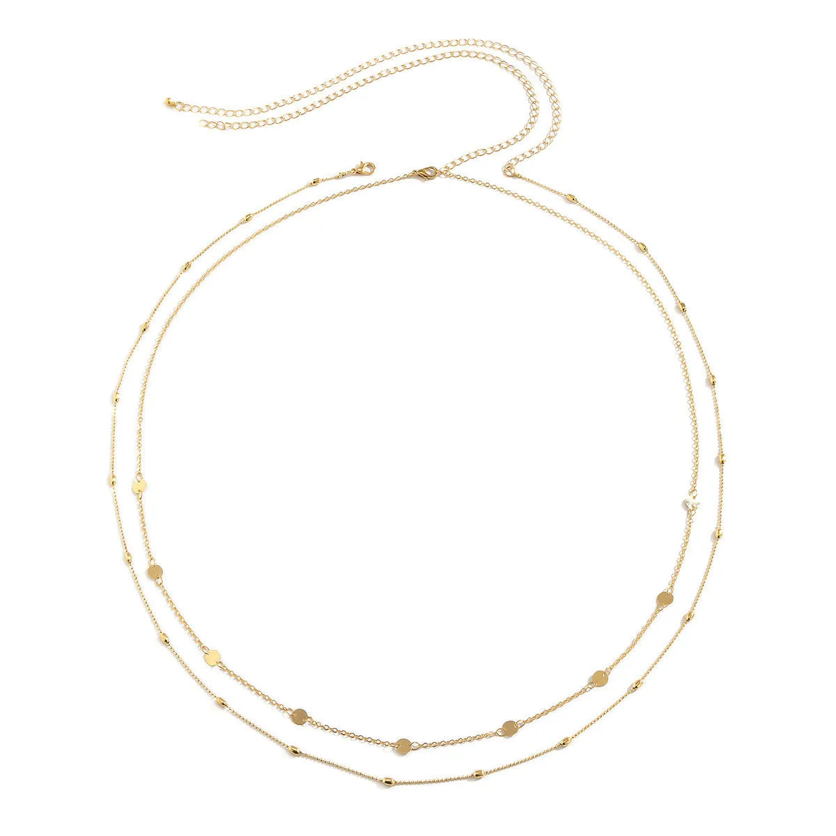 Gold double-layer belly chain with tassel detail and lobster clasp on a white background