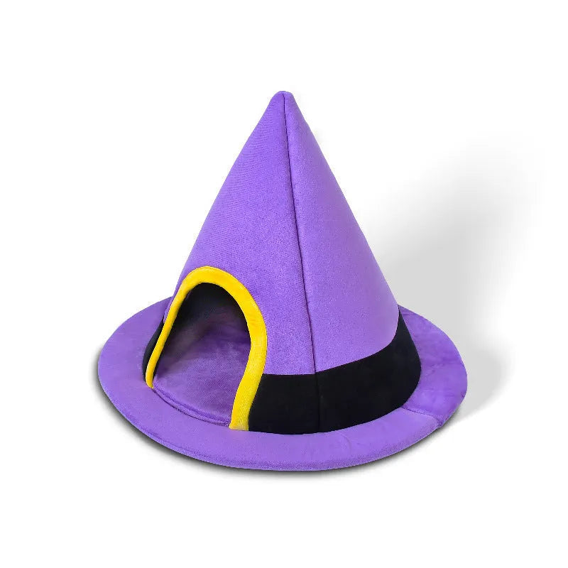 Purple witch hat-shaped cat bed for small pets, shown on a floor.
