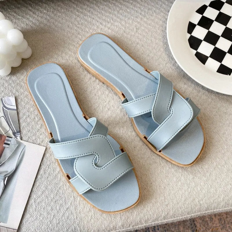 Women's PVC cross strap sandals in light blue colour showing non-slip sole and toe ring design