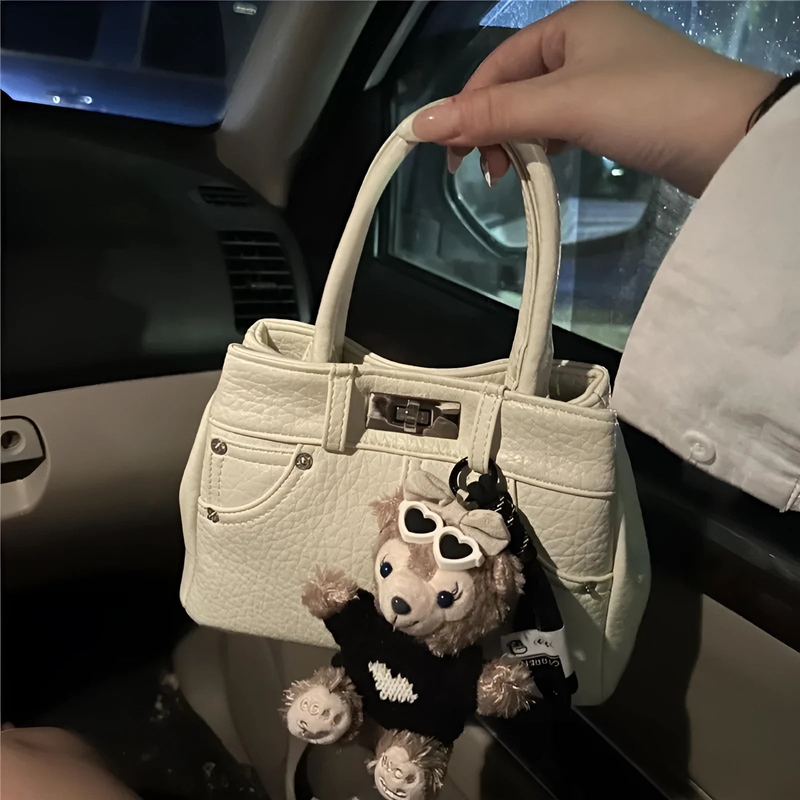 Women's casual denim shoulder handbag in soft PU material with standard sizing and polyester lining