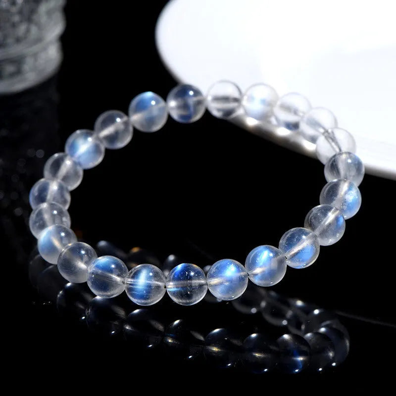 Natural cream body blue moonlight crystal bracelet showing minimalist design on wrist.