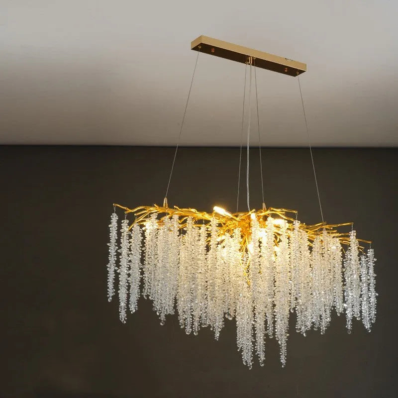 Aluminium alloy crystal chandelier light with adjustable drop, shown in round and long style options.
