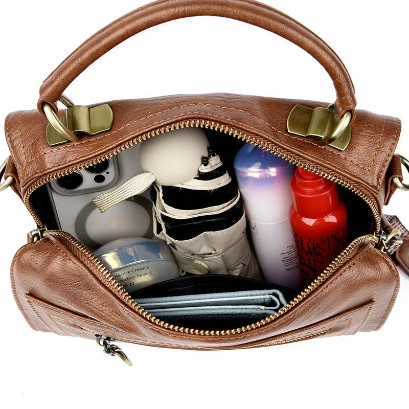 A soft PU leather women's one-shoulder crossbody bag in a horizontal square shape with retro styling.