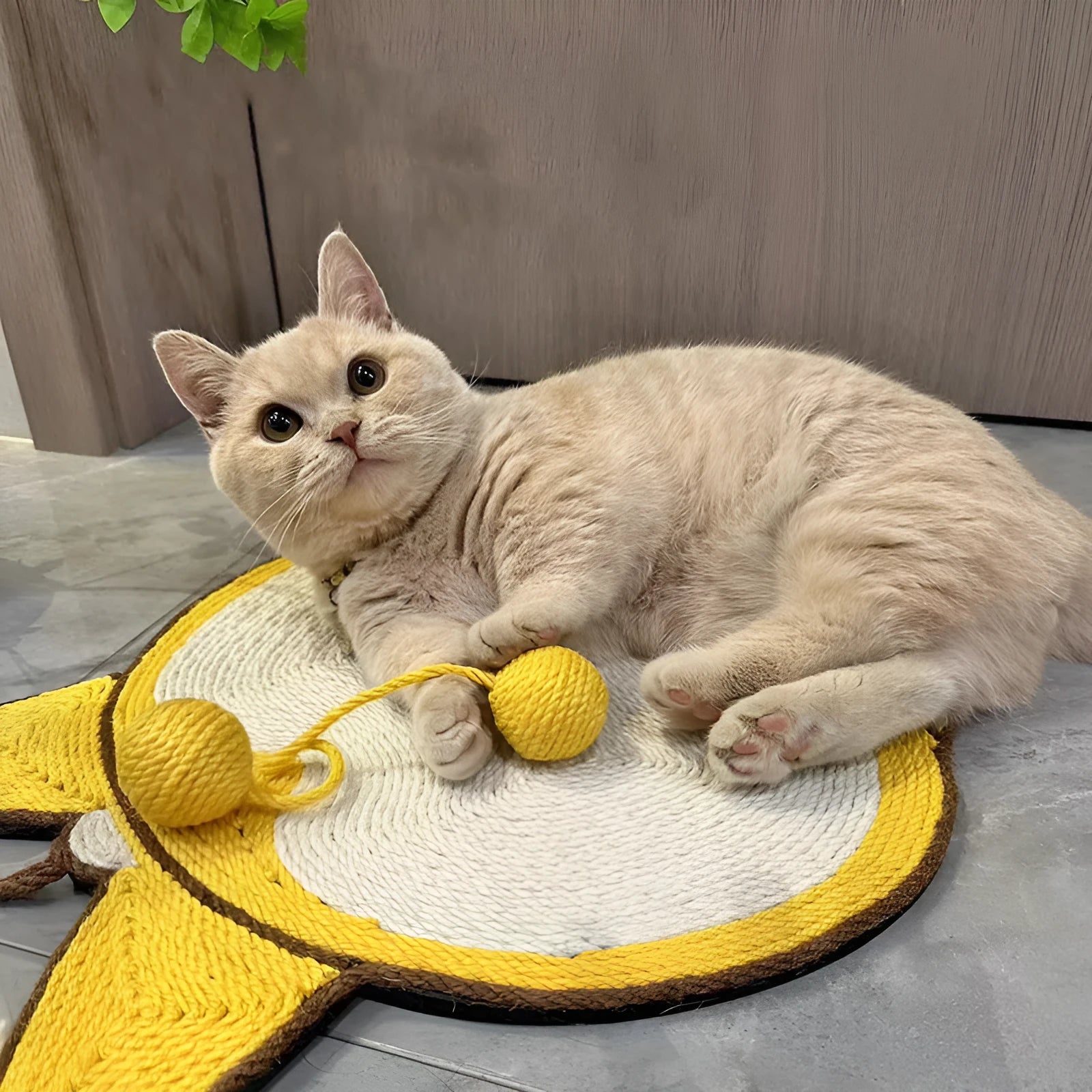 Yellow corgi-shaped sisal cat scratching pad with adhesive hooks and anti-slip base.