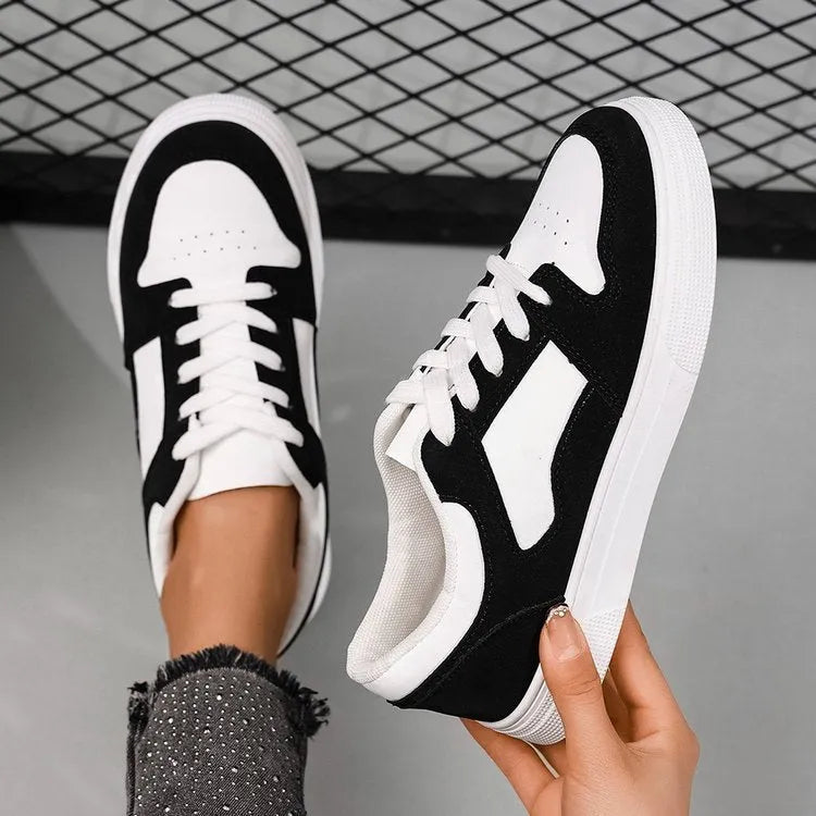 Black women's casual sports shoes with flat rubber sole and lace-up front