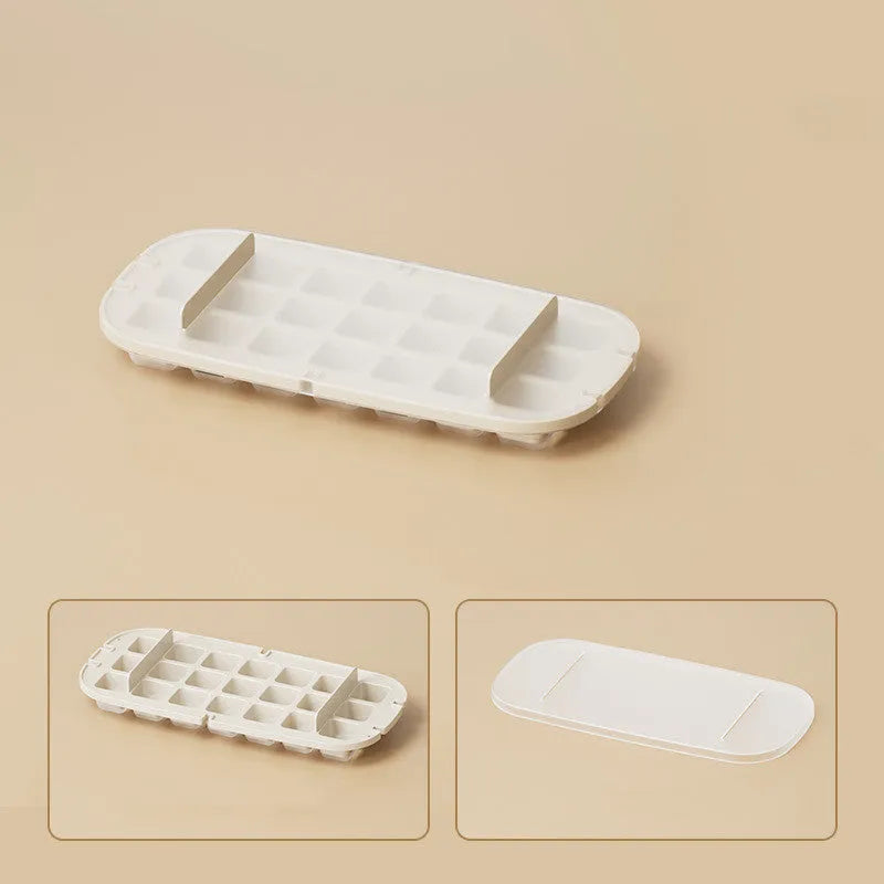 A high-capacity blue ice cube tray with a leverage-action lid and a stored ice shovel.