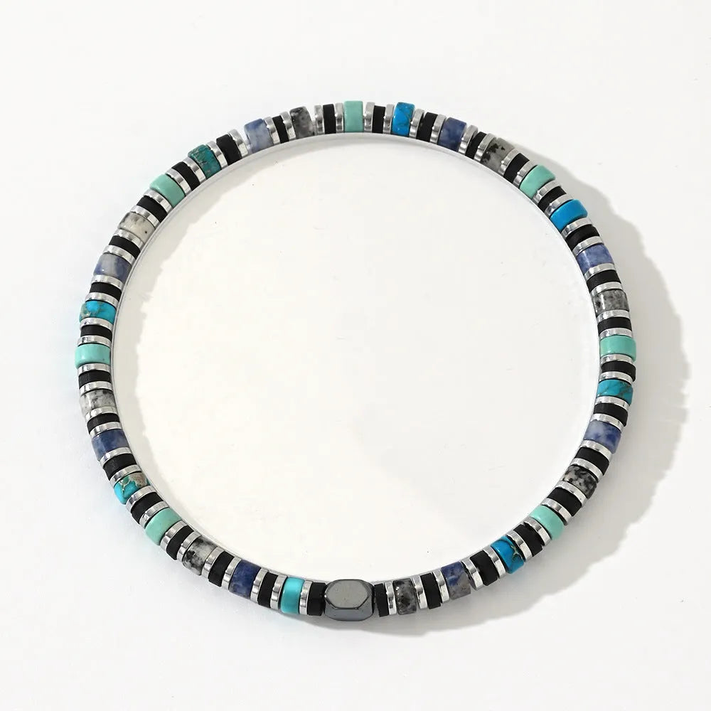 Bohemian bracelet with cylindrical semi-precious stone beads in a hand-woven geometric design.