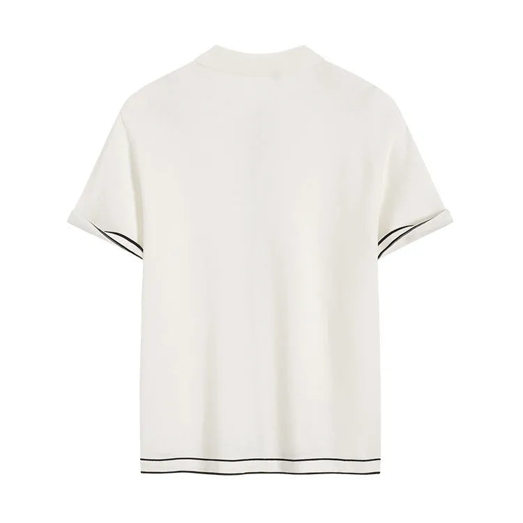 White short-sleeve cardigan with dark contrast lapels, buttoned front, and relaxed fit.