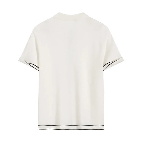 White short-sleeve cardigan with dark contrast lapels, buttoned front, and relaxed fit.