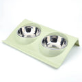 Stainless steel pet double bowl with green PP base and metal inner bowl on floor