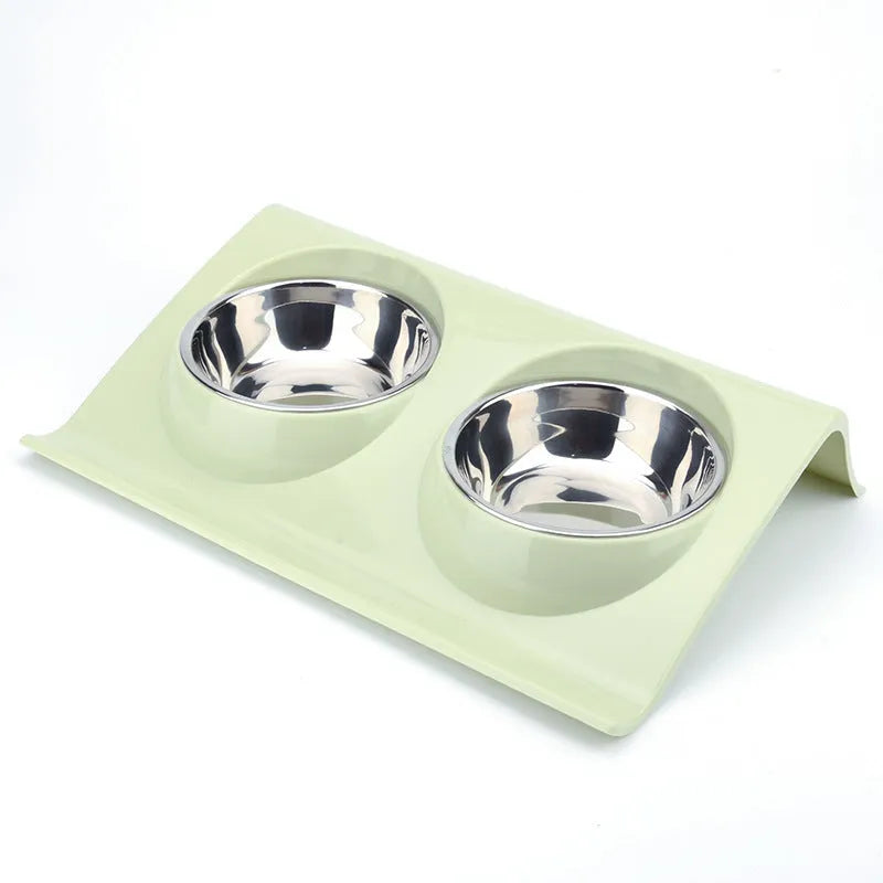 Stainless steel pet double bowl with green PP base and metal inner bowl on floor