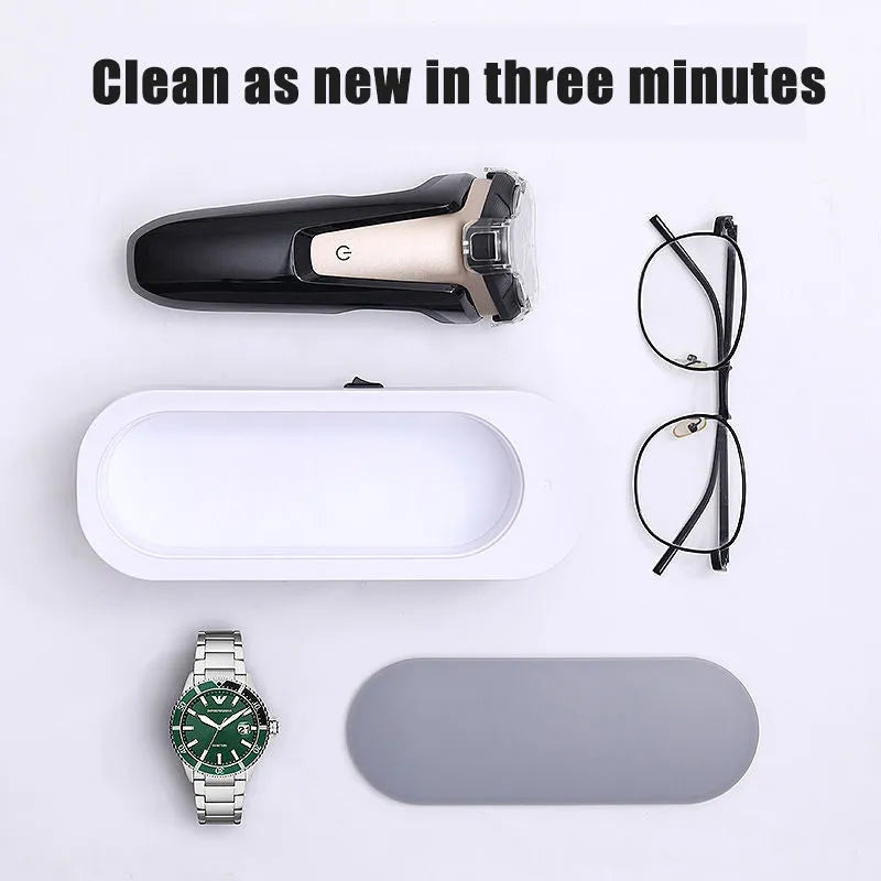 Off-white ultrasonic cleaning machine with stainless steel tank for jewellery and glasses.